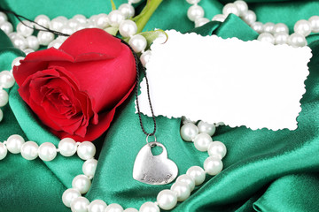 Beautiful red rose with heart pendant