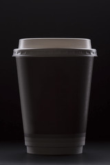 Paper coffee cup on a black background