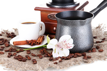cup of coffee with coffee pot close up