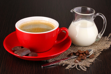 Red cup of Turkish coffee with chocolate and milk