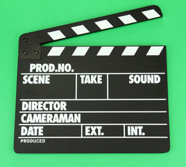 Fototapeta premium Movie production clapper board on color background