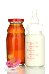 Baby food, bottle and juice isolated on white