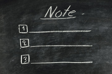 the word note written in chalk