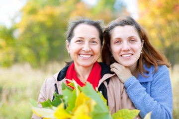   happy women in autumn  garden