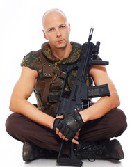 Fototapeta premium Portrait of soldier posing on white background