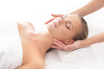 A young woman laying on a spa massage procedure