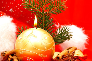 Candle with fir branch and christmas decoration