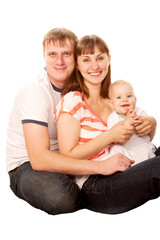 Happy family, smiling father, mother and baby.