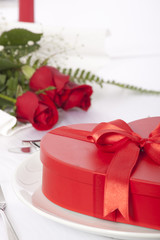 Romantic table setting with rose and cutlery 