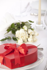 Romantic table setting with rose and cutlery 