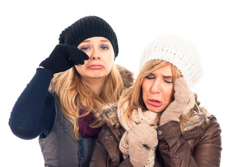 Fototapeta premium Unhappy women in winter clothes