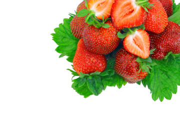A heap of strawberries on green foliage. Isolated