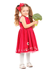 Full length portrait of a smiling girl holding a broccoli
