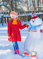 snowman and young girl