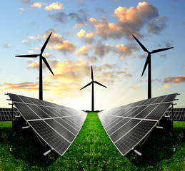 Solar panels and wind turbine in the setting sun