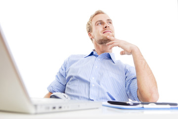 young man at office daydreaming