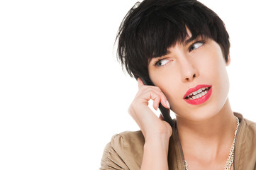 Beautiful girl talking on the cell phone, isolated on white