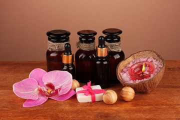 ingredients for soap making on brown background