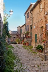 Alley in Chiusdino medieval village, Tuscany