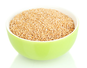 Green bowl full of wheat bran isolated on white