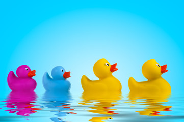 yellow rubber ducks in water.