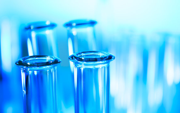 Test tubes closeup on blue background.