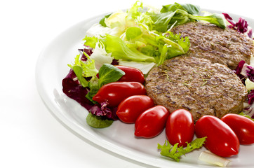 Italian Hamburgers   on a plate with fresh vegetables
