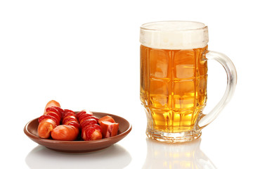 Beer and grilled sausages isolated on white