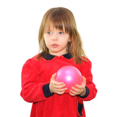 Fototapeta na wymiar Little girl with a pink ball