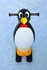 plastic sport penguin skates on ice rank