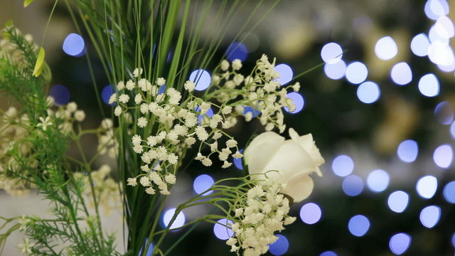 A bouquet of delicate flowers against a sparkling background