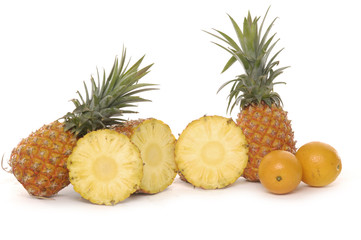 Two ripe pineapple fruits and its slices