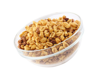 Glass bowl with cold cereal flakes. Isolated