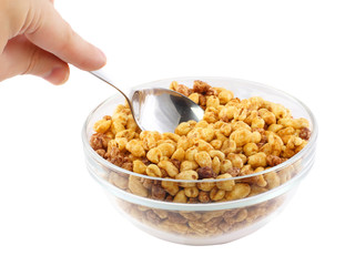 Glass bowl with cold cereal flakes. Isolated