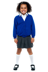 Full length portrait of a joyous African school girl
