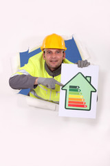 Worker with an energy rating sign
