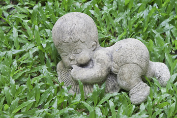 Obraz premium Baby doll on yard