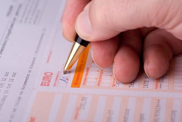 Man filling a bank transfer document