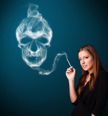 Obraz premium Young woman smoking dangerous cigarette with toxic skull smoke