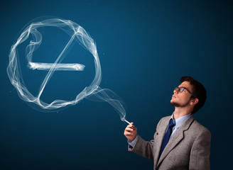 Young man smoking unhealthy cigarette with no smoking sign