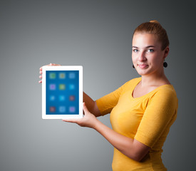 woman holding modern tablet with colorful icons