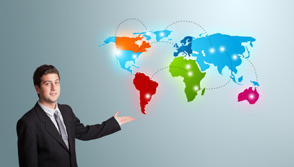 young man presenting colorful world map
