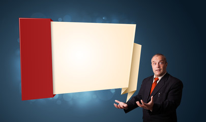 businessman presenting modern origami copy space