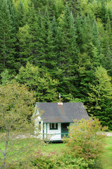 Fototapeta na wymiar Quebec, old house in Matapedia forest in Gaspesie