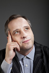 portrait of adult man isolated on dark background