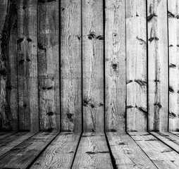 Room with wood paneled wall and wood floor