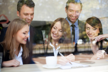 Group of business people in coffee shop