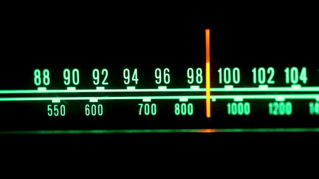 a glowing radio with the marker running through the stations