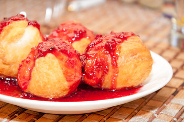 Baked dumplings with cherry jam
