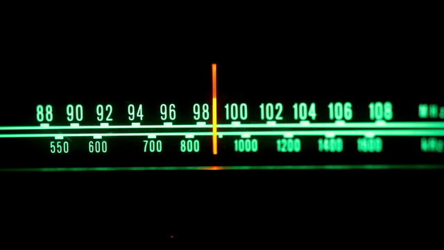 a glowing radio with the marker running through the stations